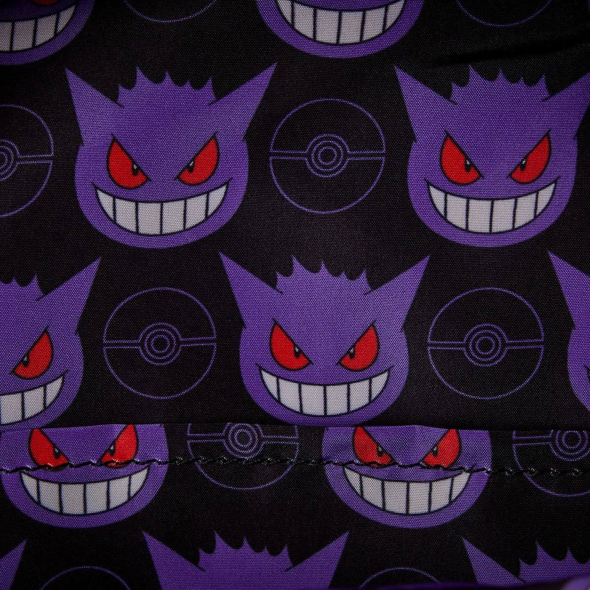 Pattern detail of purple Pokemon Gengar faces with red eyes and Pokeball icons on black fabric of a mini backpack