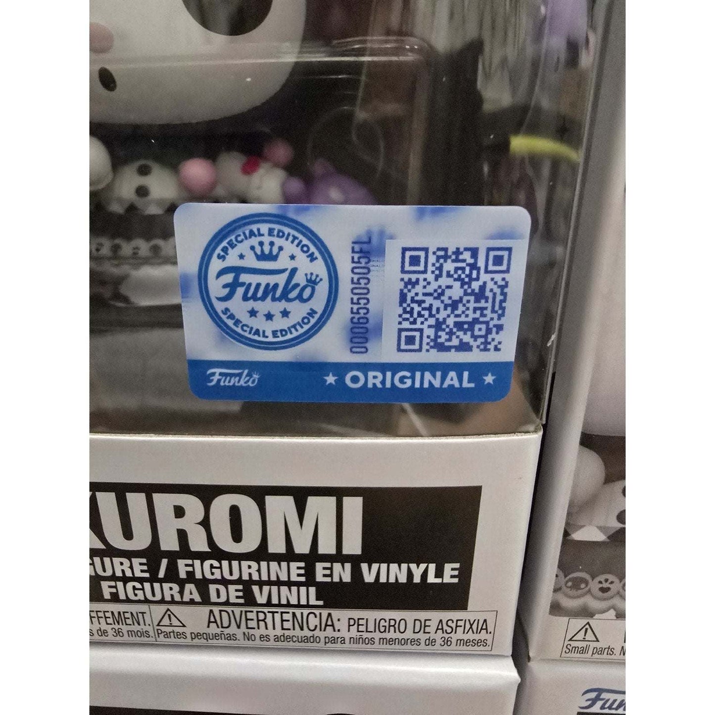Close-up of Sanrio Kuromi 20th Anniversary Funko Pop! Vinyl Figure #115 with Special Edition authenticity sticker on packaging