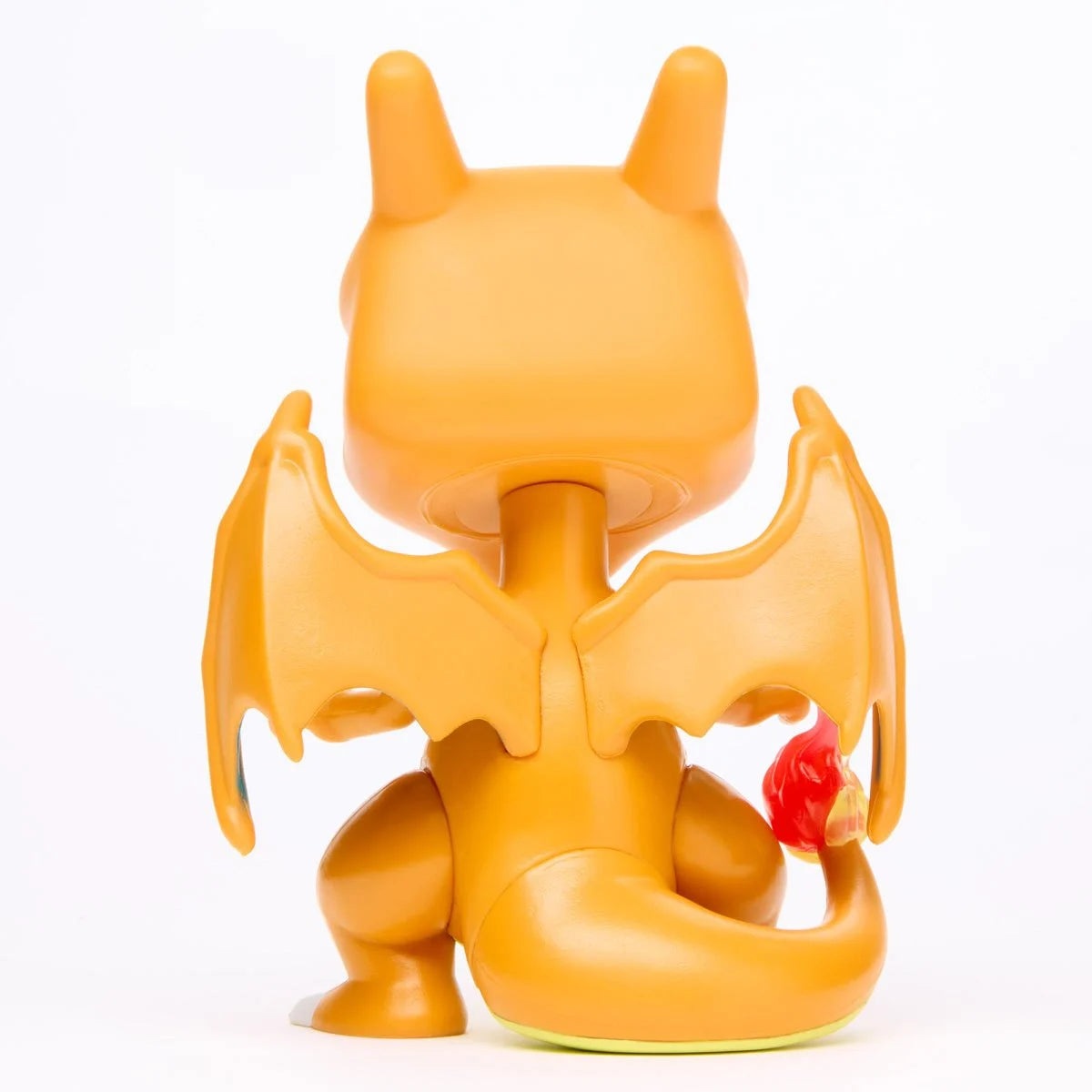 Back view of a Pokemon Charizard Funko Pop vinyl figure with wings and a flaming tail.